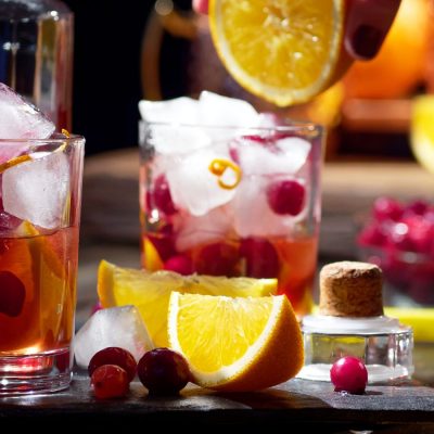 A zesty and delicious pair of Cranberry Orange cocktails in the making