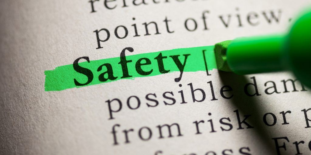 Green pen highlighting the word safety in the dictionary.