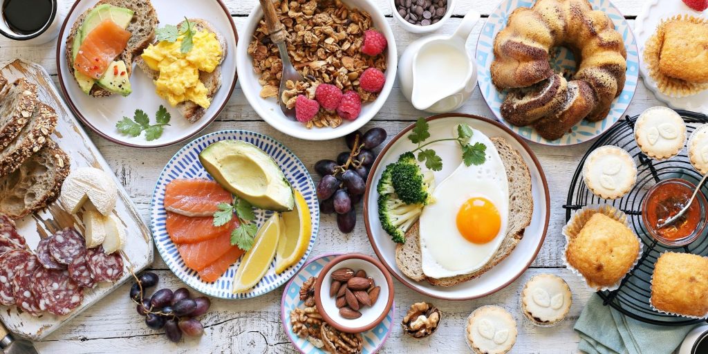 Top view of an amazing array of brunchtime foods on a table