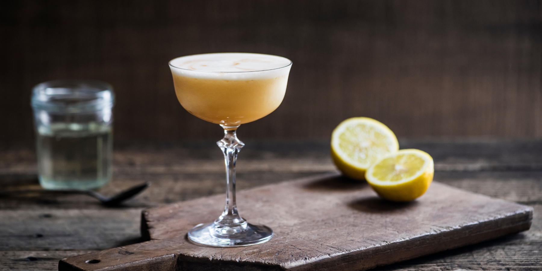 Bourbon Sour cocktail in a coupe glass with bitters garnish