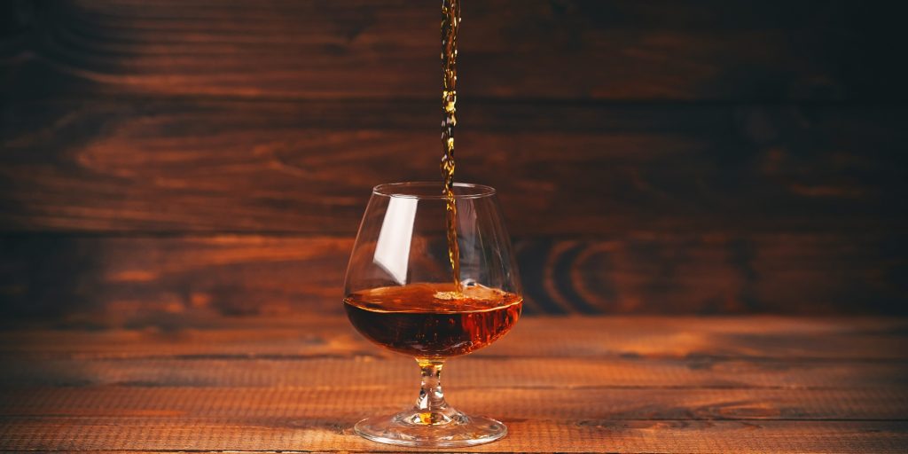 Cognac pouring into a glass, by levgenil-Meyer