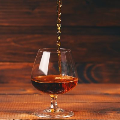 Cognac pouring into a glass, by levgenil-Meyer